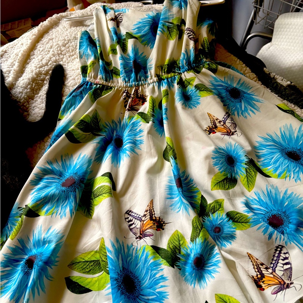 Beautiful butterfly sleeveless girls size 14 dress, perfect condition.